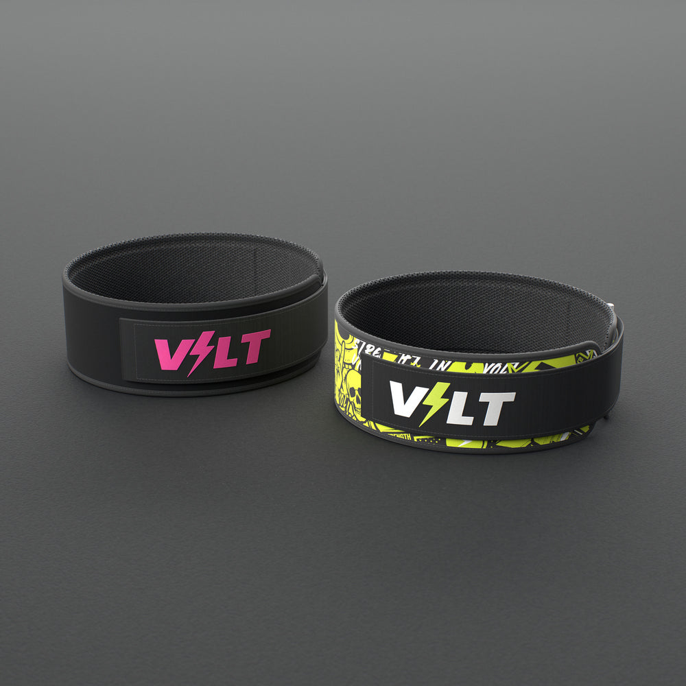 VOLT NovaBelt in Pink and IronBelt in Original, the 4 inch weightlifting belt in two of its four finishes, on a grey rubber floor