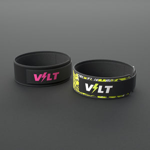 VOLT NovaBelt in Pink and IronBelt in Original, the 4 inch weightlifting belt in two of its four finishes, on a grey rubber floor