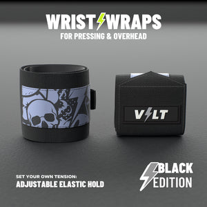 VOLT elastic wrist wraps for pressing and overhead, BlackEdition (grey print), on a grey rubber gym floor, adjustable elastic hold #BlackEdition