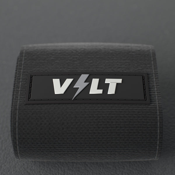 VOLT elastic wrist wraps, BlackEdition (grey print), close-up of the VOLT logo patch #BlackEdition