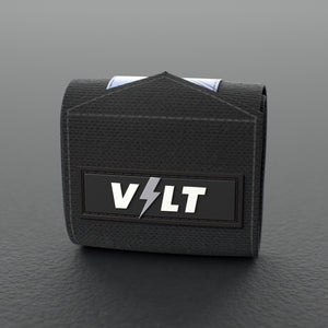 VOLT elastic wrist wraps, BlackEdition (grey print), one wrap rolled up on a grey rubber gym floor #BlackEdition