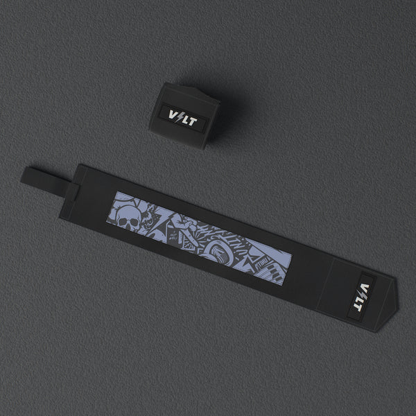 VOLT elastic wrist wraps, BlackEdition (grey print), one wrap laid out flat and one rolled, from above, on a rubber floor #BlackEdition