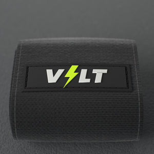 VOLT elastic wrist wraps, Original (lime print), close-up of the VOLT logo patch #Original