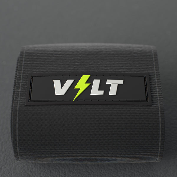 VOLT elastic wrist wraps, Original (lime print), close-up of the VOLT logo patch #Original