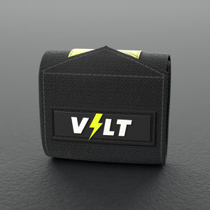 VOLT elastic wrist wraps, Original (lime print), one wrap rolled up on a grey rubber gym floor #Original