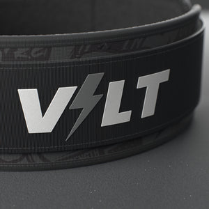 VOLT IronBelt 4" weightlifting belt, BlackEdition (grey print), close-up of the VOLT logo patch #IronBeltBlackEdition