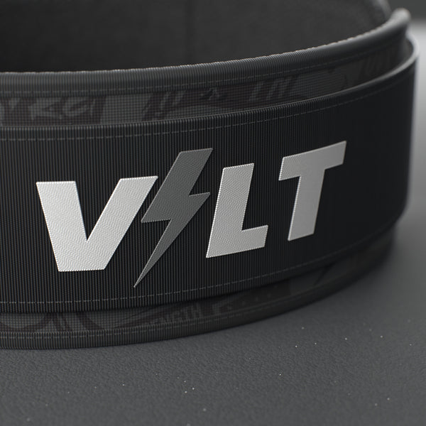 VOLT IronBelt 4" weightlifting belt, BlackEdition (grey print), close-up of the VOLT logo patch #IronBeltBlackEdition