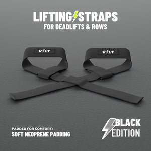 VOLT lifting straps for deadlifts and rows, BlackEdition (grey bolt on the logo patch), a pair on a grey rubber gym floor, soft neoprene padding #BlackEdition