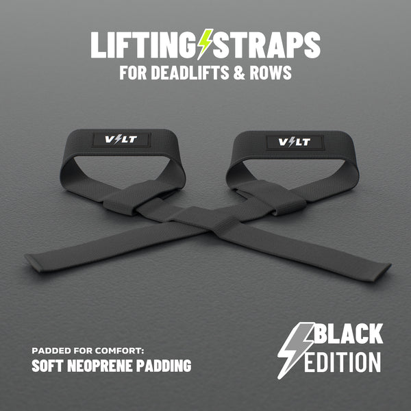 VOLT lifting straps for deadlifts and rows, BlackEdition (grey bolt on the logo patch), a pair on a grey rubber gym floor, soft neoprene padding #BlackEdition