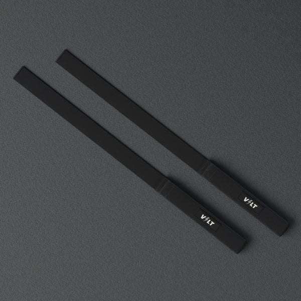 VOLT lifting straps, BlackEdition (grey bolt), a pair laid flat, from above, on a rubber floor #BlackEdition