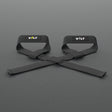 VOLT lifting straps, one Original (lime bolt) and one BlackEdition (grey bolt), on a grey rubber gym floor