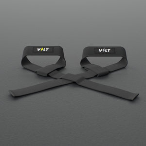 VOLT lifting straps, one Original (lime bolt) and one BlackEdition (grey bolt), on a grey rubber gym floor