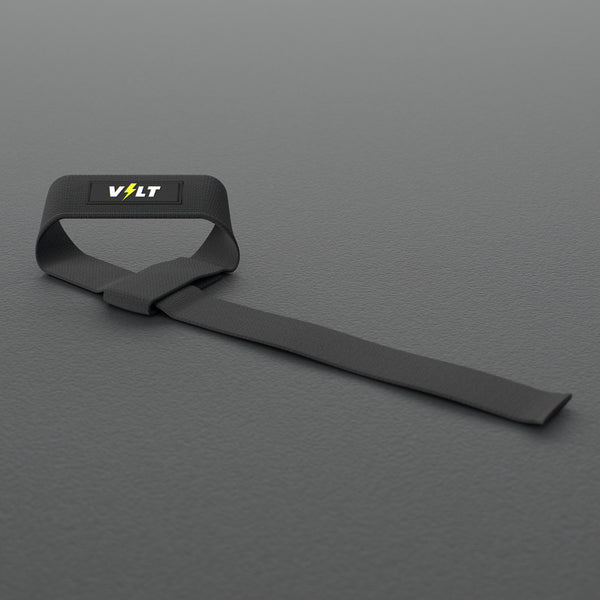 VOLT lifting straps, Original (lime bolt), one strap looped on a grey rubber gym floor #Original