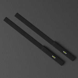 VOLT lifting straps, Original (lime bolt), a pair laid flat, from above, on a rubber floor #Original