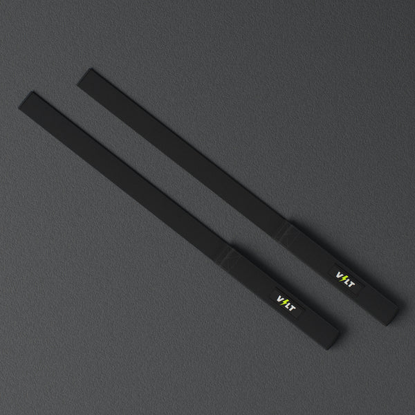 VOLT lifting straps, Original (lime bolt), a pair laid flat, from above, on a rubber floor #Original