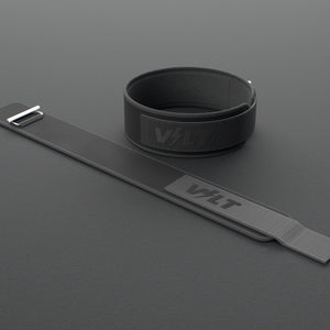 VOLT NovaBelt 4" weightlifting belt, BlackEdition (black VOLT logo on black), one fastened and one laid flat, on a rubber floor #NovaBeltBlackEdition