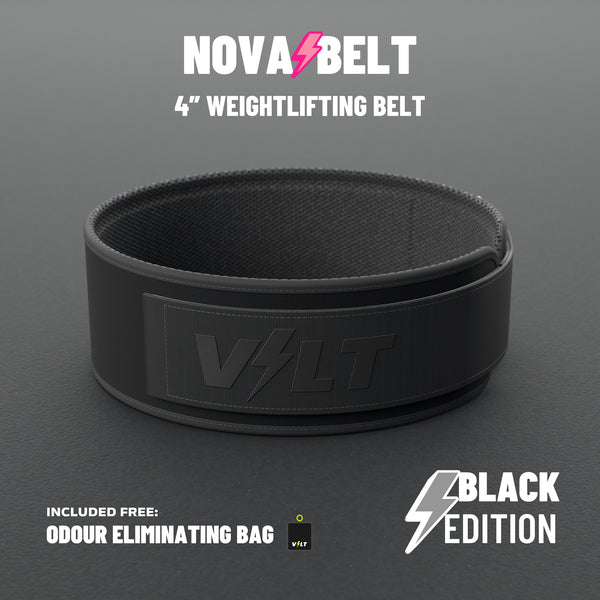 VOLT NovaBelt 4" weightlifting belt, BlackEdition (black VOLT logo on black), standing on a grey rubber gym floor #NovaBeltBlackEdition