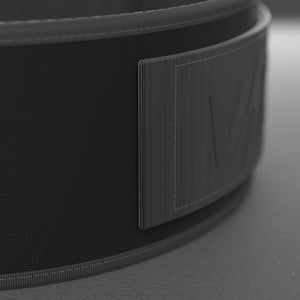 VOLT NovaBelt 4" weightlifting belt, BlackEdition (black VOLT logo on black), close-up of the strap end and VOLT tab #NovaBeltBlackEdition