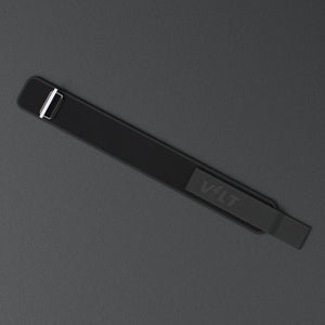 VOLT NovaBelt 4" weightlifting belt, BlackEdition (black VOLT logo on black), laid flat, from above, on a rubber floor #NovaBeltBlackEdition