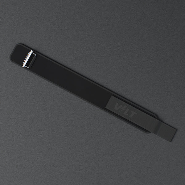 VOLT NovaBelt 4" weightlifting belt, BlackEdition (black VOLT logo on black), laid flat, from above, on a rubber floor #NovaBeltBlackEdition