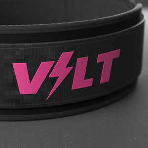 VOLT NovaBelt 4" weightlifting belt, Pink (pink VOLT logo on black), close-up of the VOLT logo #NovaBeltPink