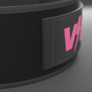 VOLT NovaBelt 4" weightlifting belt, Pink (pink VOLT logo on black), close-up of the strap end and VOLT tab #NovaBeltPink