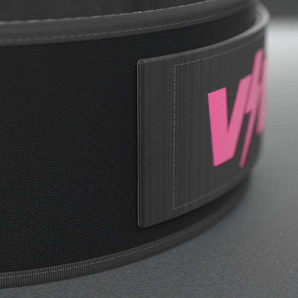 VOLT NovaBelt 4" weightlifting belt, Pink (pink VOLT logo on black), close-up of the strap end and VOLT tab #NovaBeltPink